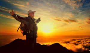 Man with fitness goals hiking mountain